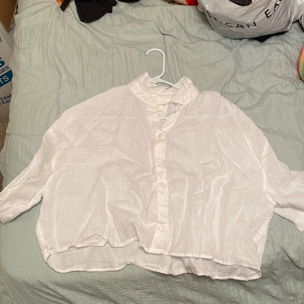 It’s a sort of see through button up crop.